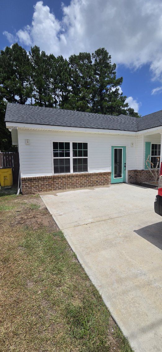 Home addition. Addition with brick skirt and lap siding.