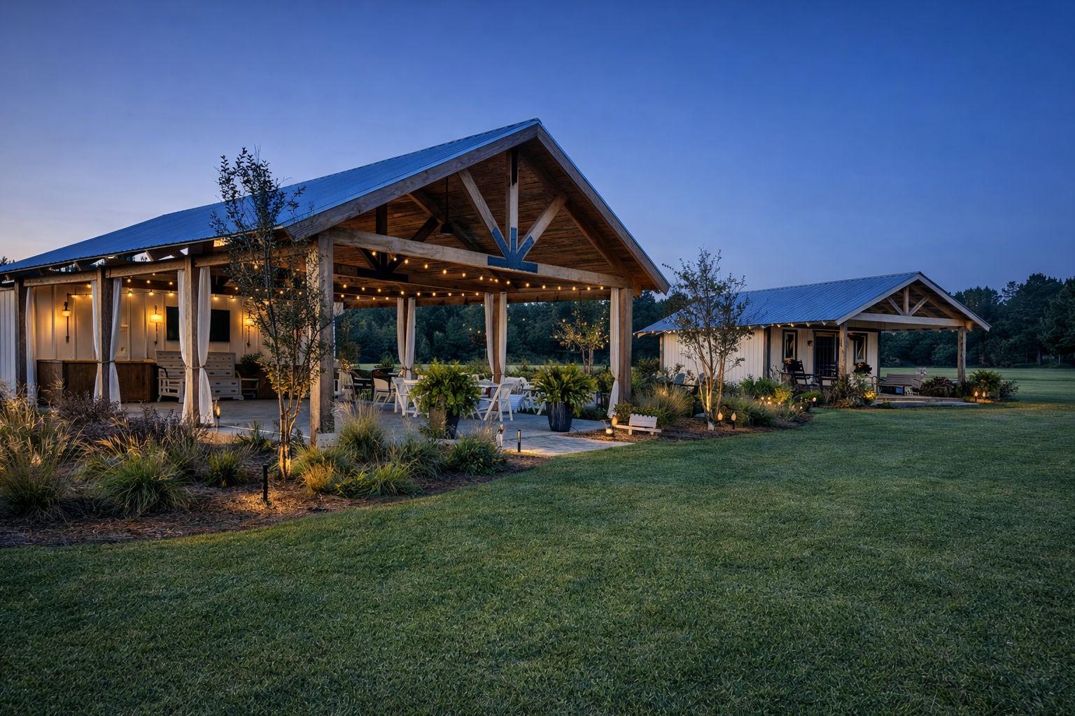 Outdoor pavilion and guest cottage. Covered pavilion with string lighting, landscaping, and a matching cottage.